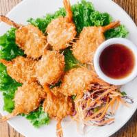 11. Coconut Prawns · Coconut battered prawns deep fried to golden brown, served with plum sauce