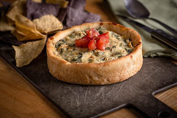 Spinach & Artichoke Dip · A housemade blend of creamy spinach and artichokes served hot with
crispy tortilla chips.