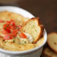 Shrimp & Crab Dip · Shrimp, crab, and parmesan dip baked and topped with diced fresh tomatoes. Served with crisp...