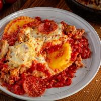 Deep Dish Ravioli Meat ''lasagna'' · Uno’s twist on a classic favorite. Three jumbo raviolis filled with creamy ricotta, topped w...