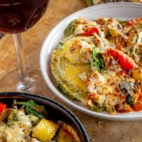 Deep Dish Ravioli Veggie ''lasagna'' · Uno’s twist on a classic favorite. Three jumbo raviolis filled with creamy ricotta, topped w...