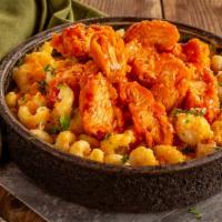 Buffalo Chicken Mac & Cheese · Cavatappi with aged cheddar, asiago, and parmesan, topped with buffalo chicken tenders and b...