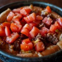 Vegan Cheeseburger Deep Dish (individual) · Our deep dish crust filled with vegan cheese and topped with crumbled BEYOND BEEF® patty, ca...