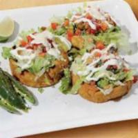 Sopes · 3 tortillas baskets deep-fried. Topped with beans, Your meat of choice, lettuce, pico de gal...