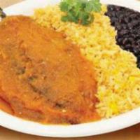 Chile Relleno · Roasted poblano pepper stuffed with ground beef, egg battered and fried, and covered in a to...