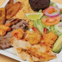 Shrimp, Steak and Chicken Breast · Served with rice, beans, salad, avocado, sweet plantains, and sour cream.
