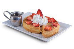 Not-So-Plain Jane · Traditional waffle topped with whipped cream, your choice of fresh strawberries or chocolate...