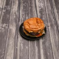 Cheeseburger · Homemade 8oz 100% Black Angus meat flame broiled, served with lettuce, tomatoes on your choi...