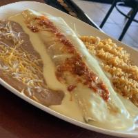 Papi's Burrito · A big burrito stuffed with beans and your choice of meat: ground beef or shredded chicken. T...