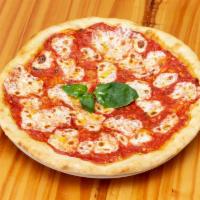 Margherita Pizza · San marzano tomato sauce, basil fresh mozzarella and extra virgin olive oil.