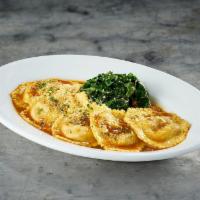 Veal Osso Buco Ravioli · Saffron-infused pasta with sautéed baby spinach and white wine demi-glace.