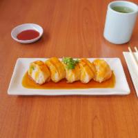 Baked Salmon Roll · Crab, avocado, baked salmon on top, with eel sauce