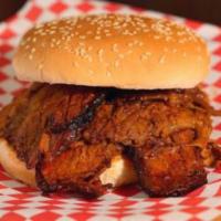 BBQ Beef Brisket Sandwich · Slow smoked and lightly sauced.
