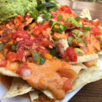 Super Sun Nachos · Monster sized nachos with SunChorizo, sunflower nacho cheese, guacamole, pico de gallo, jala...