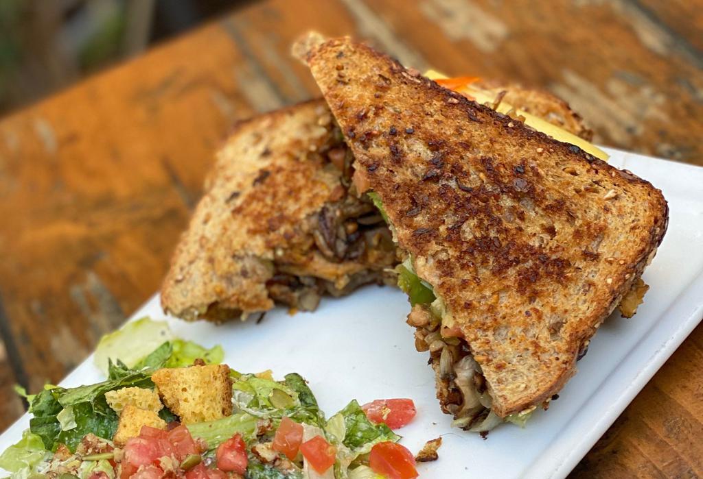 GRILLED CHEESE SANDWICH WITH SIDE DISH · Follow Your Heart Provolone cheese on Dave’s Killer bread grilled to perfection with onions, mushrooms, pico de gallo & liquid smoke.  (GF bread available)