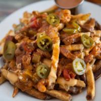 Loaded Fries · Our fair style fries topped with our house-made BBQ beans, cheese sauce and jalapenos.
