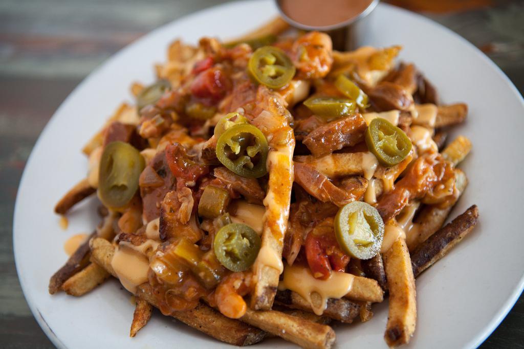 Loaded Fries · Our fair style fries topped with our house-made BBQ beans, cheese sauce and jalapenos.