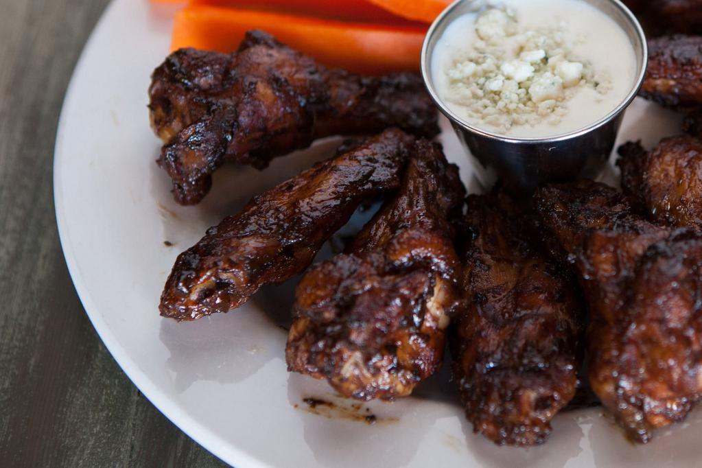 1/2 Order Cherry Wood Smoked Wings · 5 large Wings coated with our own blend of spices, smoked and served with our house-made ramch, blue cheese or jalapeño ranch dressings. Served with carrots  and celery.