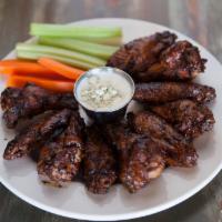 Full Order Cherry Wood Smoked Wings · 10 large Wings coated with our own blend of spices, smoked and served with our house-made ra...