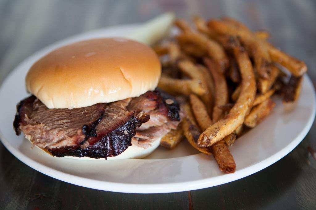 Lean Beef Brisket Sandwich · Our brisket is hickory smoked for 14 hours and then hand-carved when you order.