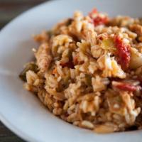 Bourbon Street Jambalaya · Shrimp, andouille sausage, smoked chicken and rice simmered in a spicy tomato sauce. Served ...