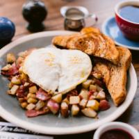 Corn Beef Hash · Housemade hash with corned beef, garlic, onions, potatoes, topped with 2 eggs and toast.