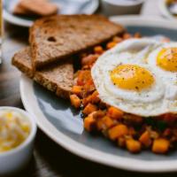 Sweet Potato Hash · Homemade hash with sweet potato, bacon, onion, red bell pepper, jalapeno, topped with 2 eggs...