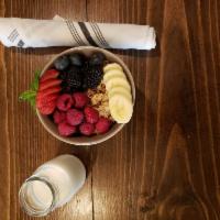 Fruit and Granola Bowl · Granola with fresh seasonal fruit and a side of milk. Substitute Greek for an additional cha...