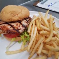 Grilled chicken Sandwich · Grilled chicken breast served on a butter toasted potato roll with garlic aioli, shaved lett...