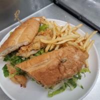 Fish Sandwich · Hand battered cod-roasted garlic aioli-lettuce-tomato- served with fries.