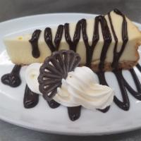 Cheesecake · New York style cheesecake with your choice of raspberry or chocolate topping.