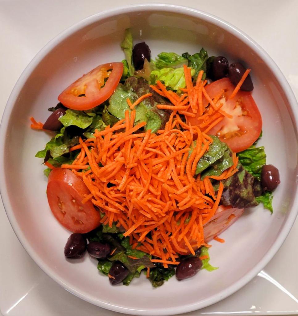 Insalata Mista · Mixed greens, tomatoes, carrots, olives, fine herbs, red wine vinegar and extra virgin olive oil.