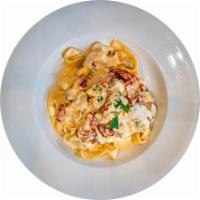 Pappardelle alla Toscanese · Fresh wide ribbon pasta, sun-dried tomatoes, wild mushroom, Marsala wine, aged Parmigiana, P...