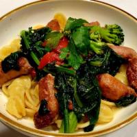Orecchiette con la Salsicce · Sweet Italian sausage with spinach, broccoli, olive oil and garlic in wine sauce.