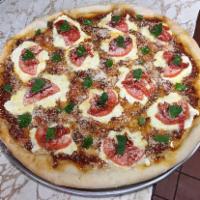 Margherita Pizza · Fresh mozzarella, plum tomatoes, fresh basil, Parmesan cheese, garlic and oil.