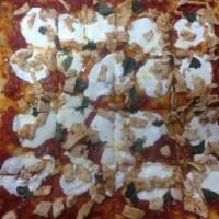 Grandma Sicilian Pizza · Fresh mozzarella, plum tomatoes, fresh basil, Parmesan cheese and garlic oil.