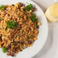 Arroz Chaufa · Peruvian style fried rice with chicken or beef. Beef is available for an additional charge.