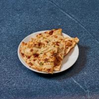 Butter Naan · Traditional white bread and baked in the tandoor.