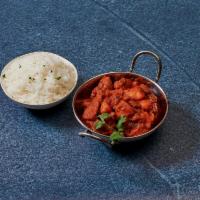 Chicken Vindaloo · Chicken and potatoes simmered in a delicious blend of red chilies, ginger, garlic and spices.