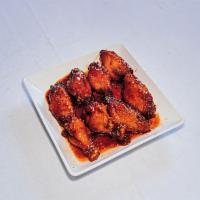 8 House Chicken Wings · Cooked wing of a chicken coated in sauce or seasoning.