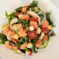 Alaska Salad · Greens, smoked salmon, tomatoes, cucumbers, carrots, red onions and mushrooms.