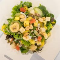 Tropical Salad · Choice of greens, cucumbers, pineapple, dried fruit mix, mango, bell pepper, and a mix of nu...