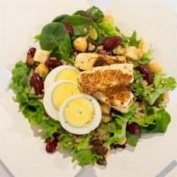 YOU+ Proteins Salad · Greens, warm grains, halloumi, bacon, boiled egg, chickpeas, red beans, almonds and mix seeds.