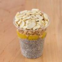 Chia Seed Pudding with Peaches · Includes granola and almond flakes.