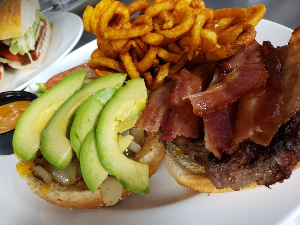 Cali Burger · Cheddar, grilled onions, bacon, avocado and chipotle mayo. Served on a brioche bun with coleslaw and pickle.