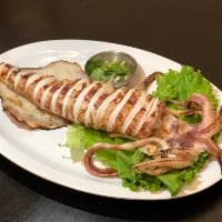 Grilled Jumbo Squid · Fresh grilled jumbo squid served with house spicy seafood sauce.