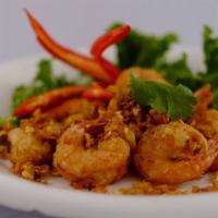 Garlic Shrimp · Deep fried marinated shrimp on shell with garlic and pepper served with chili sauce.