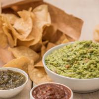 Homemade Guacamole + Chips · Fresh tortilla chips and a generous portion of the best guacamole in Chicago