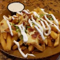 Loaded Fries · Boardwalk fries, beer cheese, crumbled bacon, green onion, sour cream, ranch dipping sauce.