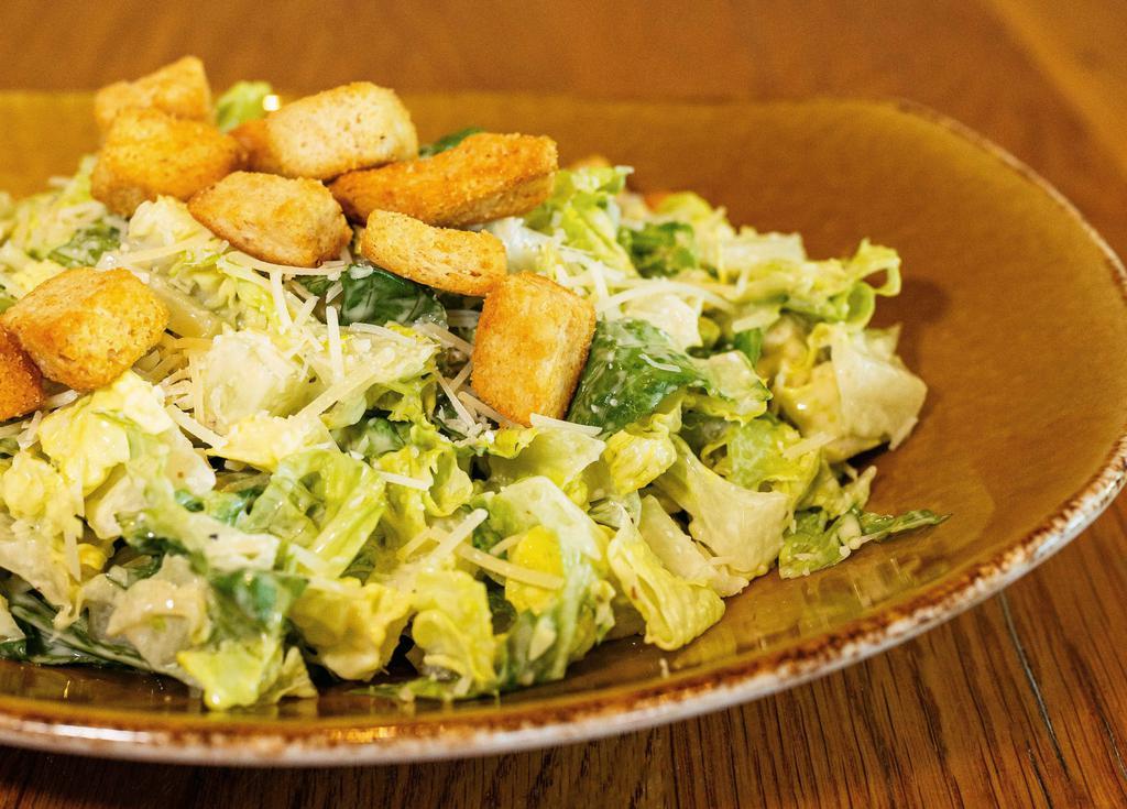 Caesar Salad · Chopped romaine, shredded Parmesan cheese, garlic croutons, Caesar dressing.